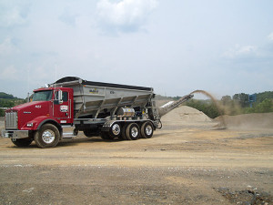 Down to Earth Stone Slinging uses a stone slinger truck like this one to place to deposit landscaping and construction material exactly where it's needed.
